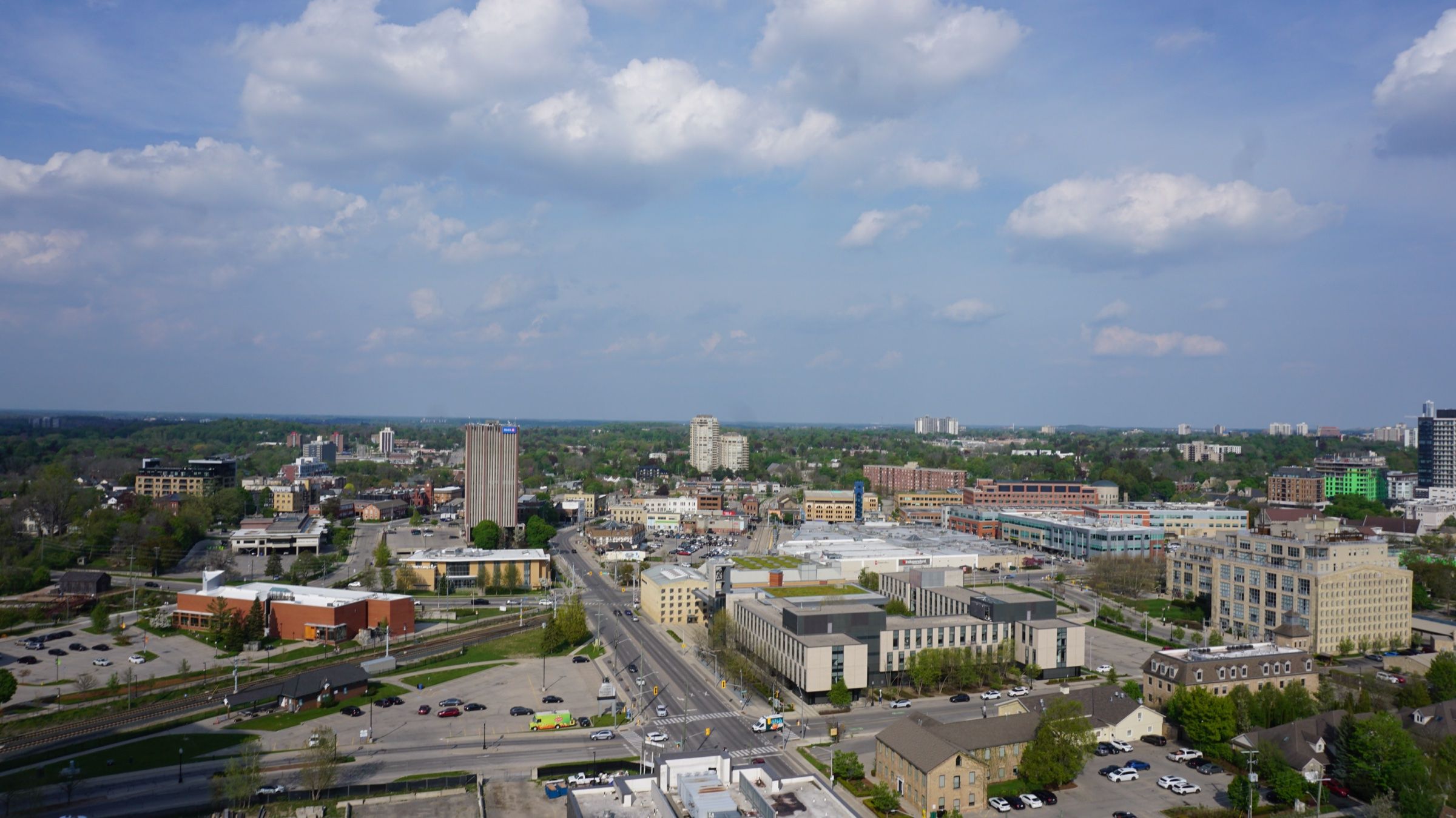 Uptown Waterloo from the air, its low towers and the main street running through the centre of the city, with the countryside on the horizon